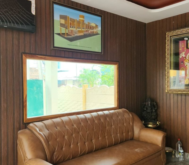 Lobby lounge with traditional Thanjavur artwork at Vishaka INN